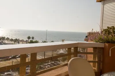 a balcony with a view of the ocean at LOS INFANTES 7-5-24 in Sanlúcar de Barrameda