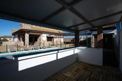 a view of a swimming pool from the inside of a house at El Castillito in Chiclana de la Frontera