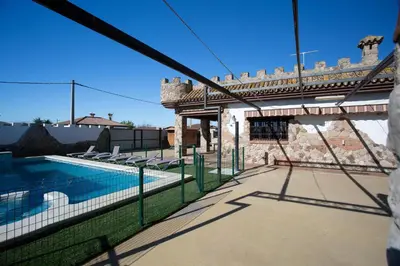 a house with a swimming pool and a bridge at El Castillito in Chiclana de la Frontera