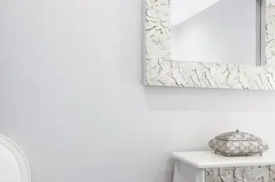 a mirror on a wall next to a white table at Little LIBERTAD Heart of Cadiz Grupo AC Gestion in Cádiz