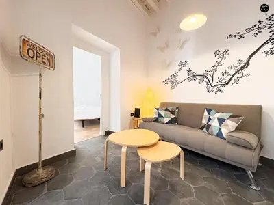 a living room with a couch and a table at Posada Flamenco Grupo AC Gestion in Cádiz