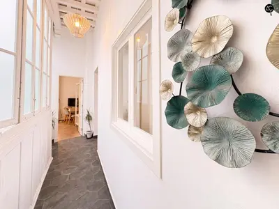 a hallway with umbrellas on the wall at Posada Flamenco Grupo AC Gestion in Cádiz