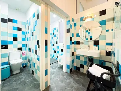 a bathroom with a sink and a toilet and a mirror at Posada Flamenco Grupo AC Gestion in Cádiz