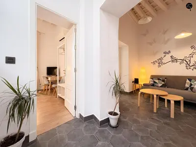 a living room with a couch and a table at Posada Flamenco Grupo AC Gestion in Cádiz