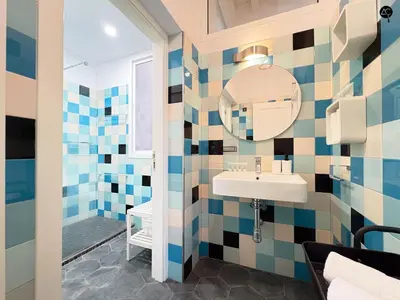 a bathroom with a sink and a mirror at Posada Flamenco Grupo AC Gestion in Cádiz