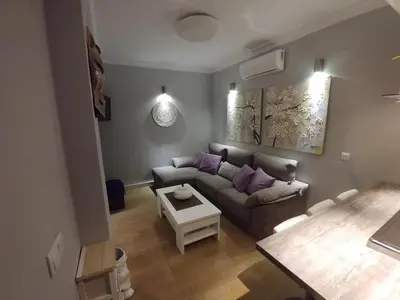 a living room with a couch and a table at Apartamento Solis in Chipiona