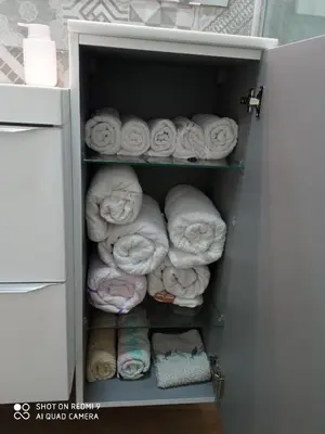 a bunch of towels are stacked in a closet at Apartamento Solis in Chipiona