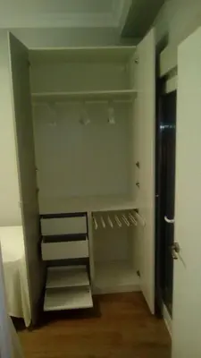 a walk in closet with shelves and a door at Apartamento Solis in Chipiona
