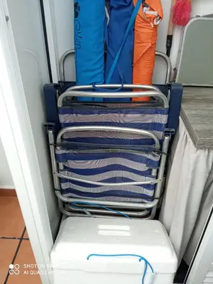 a walk in closet with a rack of clothes at Apartamento Solis in Chipiona