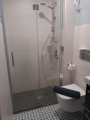 a bathroom with a shower with a toilet and a sink at Frente al mar in Rota