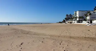 a view of a beach with footprints in the sand at Frente al mar in Rota