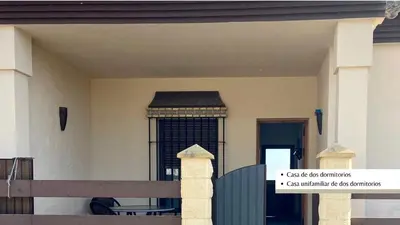 a house with a gate and a fence at Arco Casas Adosadas in Conil de la Frontera
