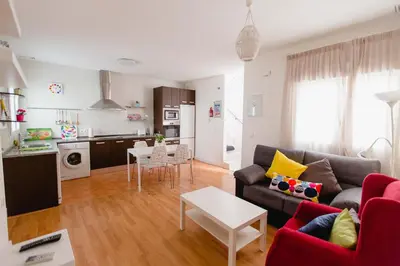 a living room with a couch and a table at Atico Centro Historico in Cádiz