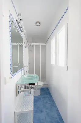 a bathroom with a sink and a toilet at Atico Centro Historico in Cádiz