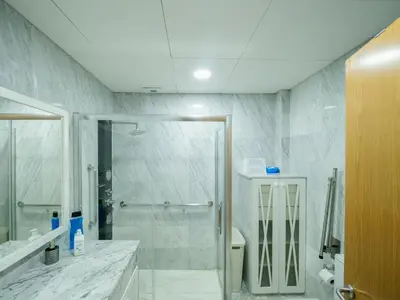a bathroom with a shower with a glass door at Apto Valdespino Gran Terraza fjhomefj in Jerez de la Frontera
