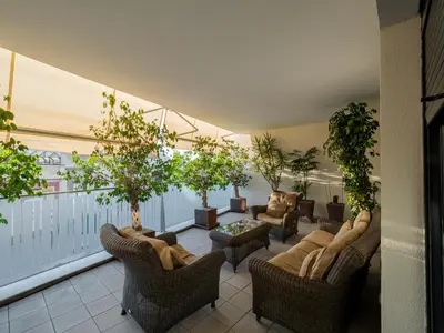 a living room with furniture and trees on a balcony at Apto Valdespino Gran Terraza fjhomefj in Jerez de la Frontera