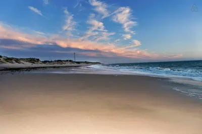 a beach with the ocean and a cloudy sky at APARTAMENTO VILLA DE ROTA - VISTA MAR, 135m2, Terraza, SAT TV y más in Rota