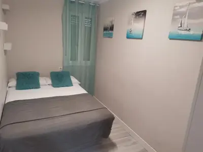 a bathroom with a sink and a mirror at Casasjerezanas Mariposa in Jerez de la Frontera
