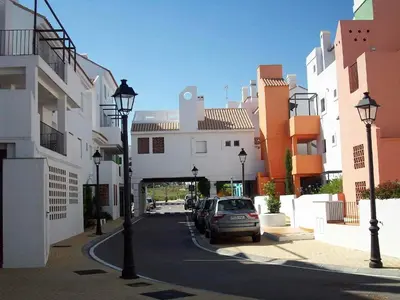 a car parked on a street in a city at Cadiz Golf in Sanlúcar de Barrameda