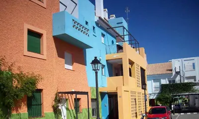 a building with a street light in front of it at Cadiz Golf in Sanlúcar de Barrameda