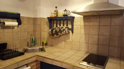 a kitchen with a sink and a counter top at CASA RICARDO 