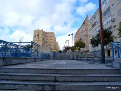 a group of stairs in a city with buildings at Emperador Carlos in San Fernando