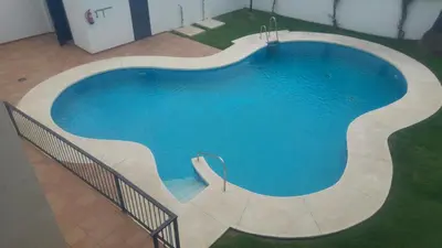 an overhead view of a swimming pool in a building at Dúplex centro, climatizado, garaje, piscina, WIFI in Sanlúcar de Barrameda
