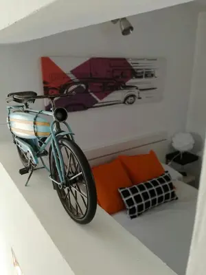 a bike parked on a wall in a room at Atico SIROCO in Sanlúcar de Barrameda