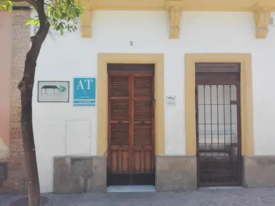two doors on the side of a building at Casa Jerez Alameda del Banco in Jerez de la Frontera
