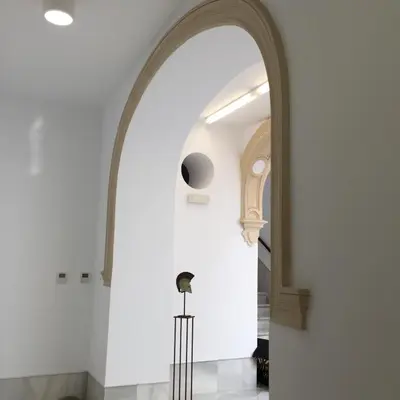an arched hallway with an archway in a building at CASA PALACIO en Jerez de la Frontera con piscina privada in Jerez de la Frontera