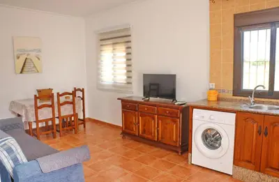 a kitchen with a washing machine in a kitchen at Casa El Cortijillo in Conil de la Frontera