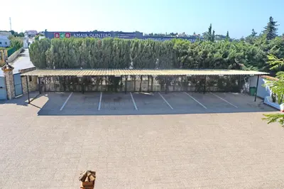 a tennis court with a bench in a parking lot at Chalet Pradillo II in Conil de la Frontera
