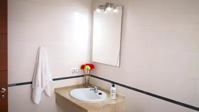 a bathroom with a sink and a mirror at Zambra. Luminoso y coqueto apartamento en Chiclana in Chiclana de la Frontera
