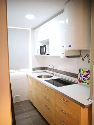 a kitchen with a sink and a microwave at Zambra. Luminoso y coqueto apartamento en Chiclana in Chiclana de la Frontera