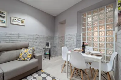a living room with a couch and a table at Apartamento Maribel in Cádiz