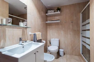 a bathroom with a sink and a toilet at Apartamento Maribel in Cádiz
