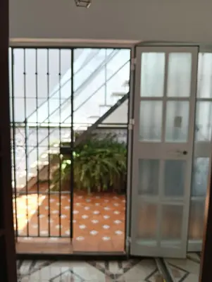 an open door of a building with a staircase at Casa Algarabía in Sanlúcar de Barrameda