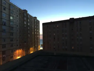 a view from the rooftop of a building at sunset at Loft Playa Santa María (Cádiz) in Cádiz