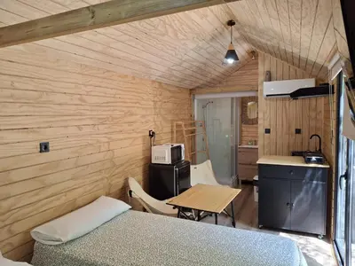 a swimming pool with lounge chairs and a swimming pool at Bungalows y Glamping Medina Sidonia in Medina Sidonia
