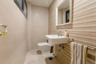 a bathroom with a sink and a toilet at Apartamento Duplex La Estrella in Cádiz
