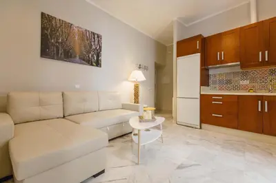 a living room with a couch and a table at Apartamento La Casa del Almirante in Cádiz