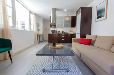 a living room with a couch and a table at Atico de los FRANCESES by Cadiz4Rentals in Cádiz
