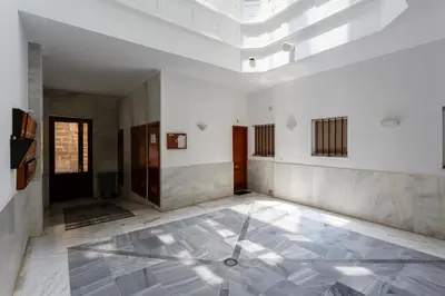 an empty room with a glass floor in a building at Atico de los FRANCESES by Cadiz4Rentals in Cádiz