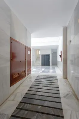 a hallway with a rug on the floor at Atico de los FRANCESES by Cadiz4Rentals in Cádiz