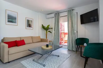 a living room with a couch and a table at Atico de los FRANCESES by Cadiz4Rentals in Cádiz