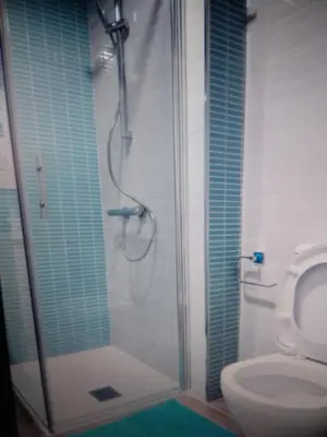 a bathroom with a shower and a toilet at VIVIENDA TURISTICA MARANt 2 in El Puerto de Santa María