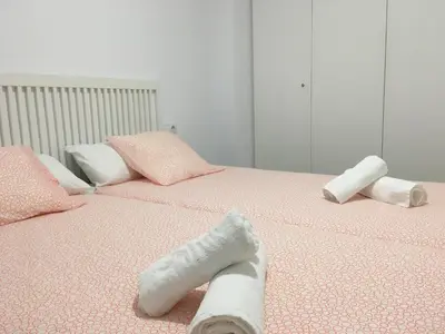 a pair of socks on top of a bed at Alameda apodaca in Cádiz