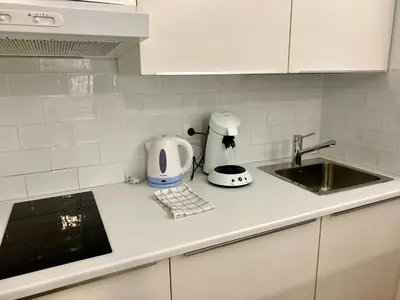 a kitchen counter with a sink and a toaster at Alameda apodaca in Cádiz