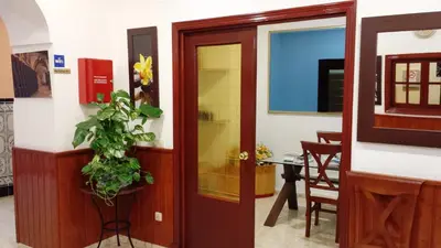 a room with a door and a potted plant at Sanvi Xerez Centro in Jerez de la Frontera