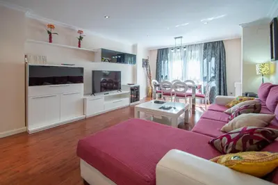 a living room with a couch and a table at Apartamento El Pentagrama de Cádiz in Cádiz